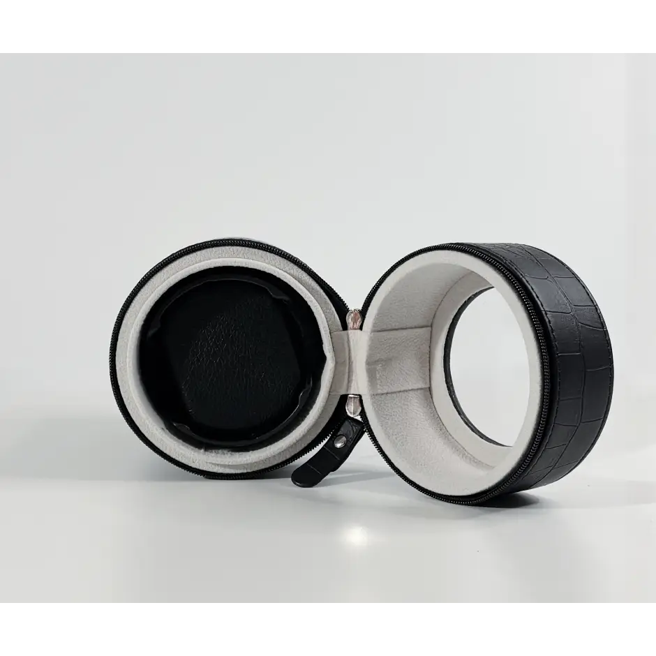 Black travel winder in crocodile faux leather with grey suede interior for one automatic watch.