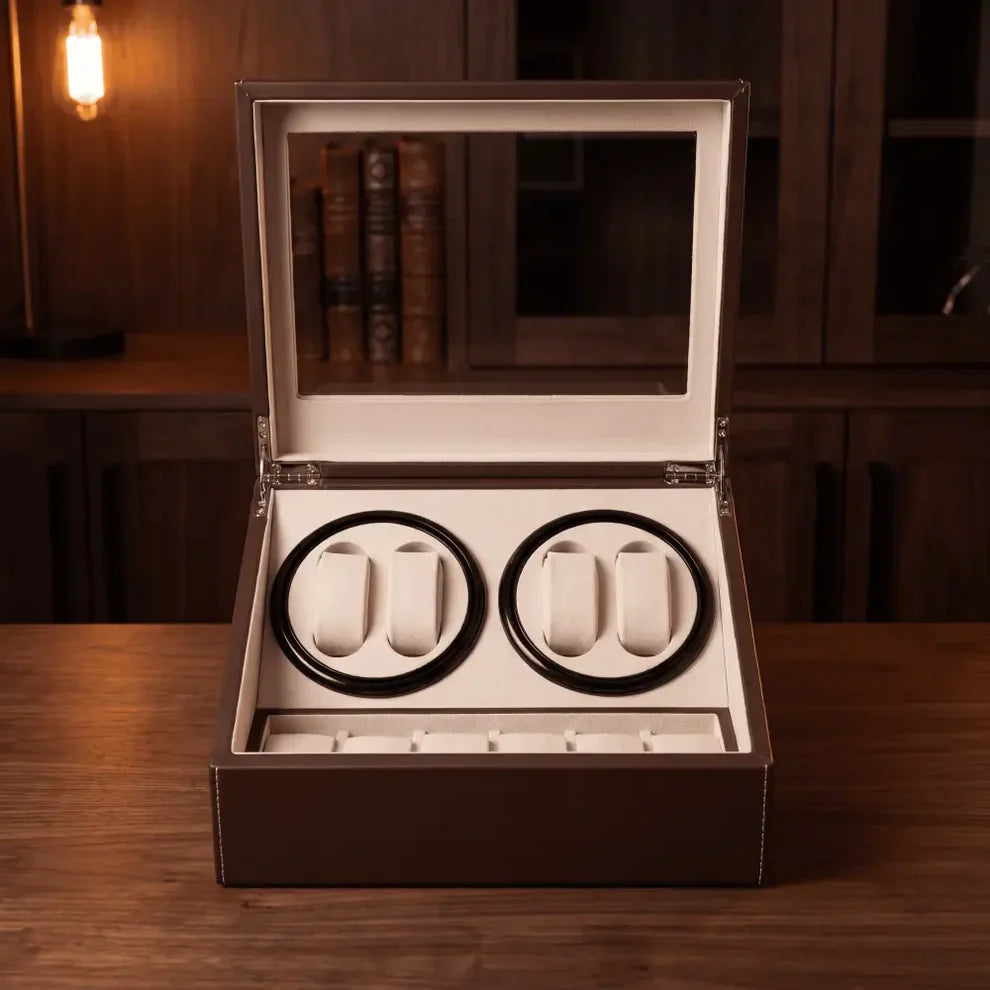 Brown leather watch winder with 4 automatic rotors and 6 storage slots, beige suede interior and glass lid.