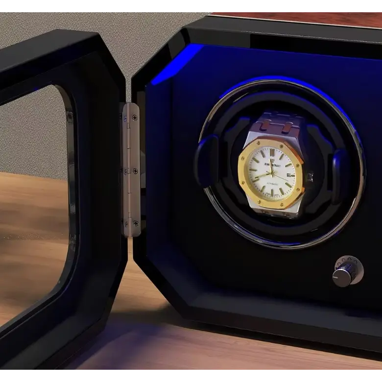 Watch winder for 2 watches in wood and black carbon fibre with blue LED lighting and a protective glass door.
