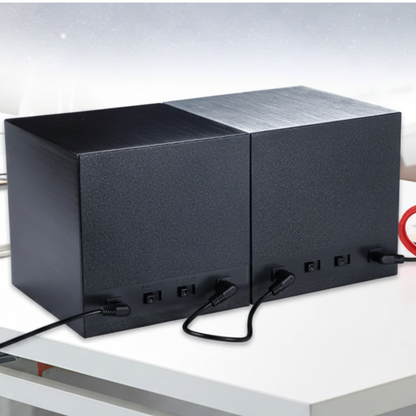 Black aluminium Cube Prestige watch winder with two slots and power cables at the rear.