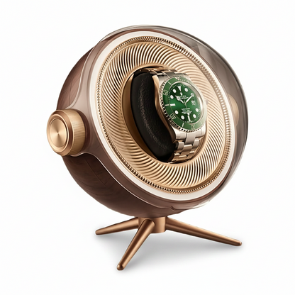 Tripode Solo Gold watch winder with a modern spherical design, tripod stand and green-dial automatic watch.
