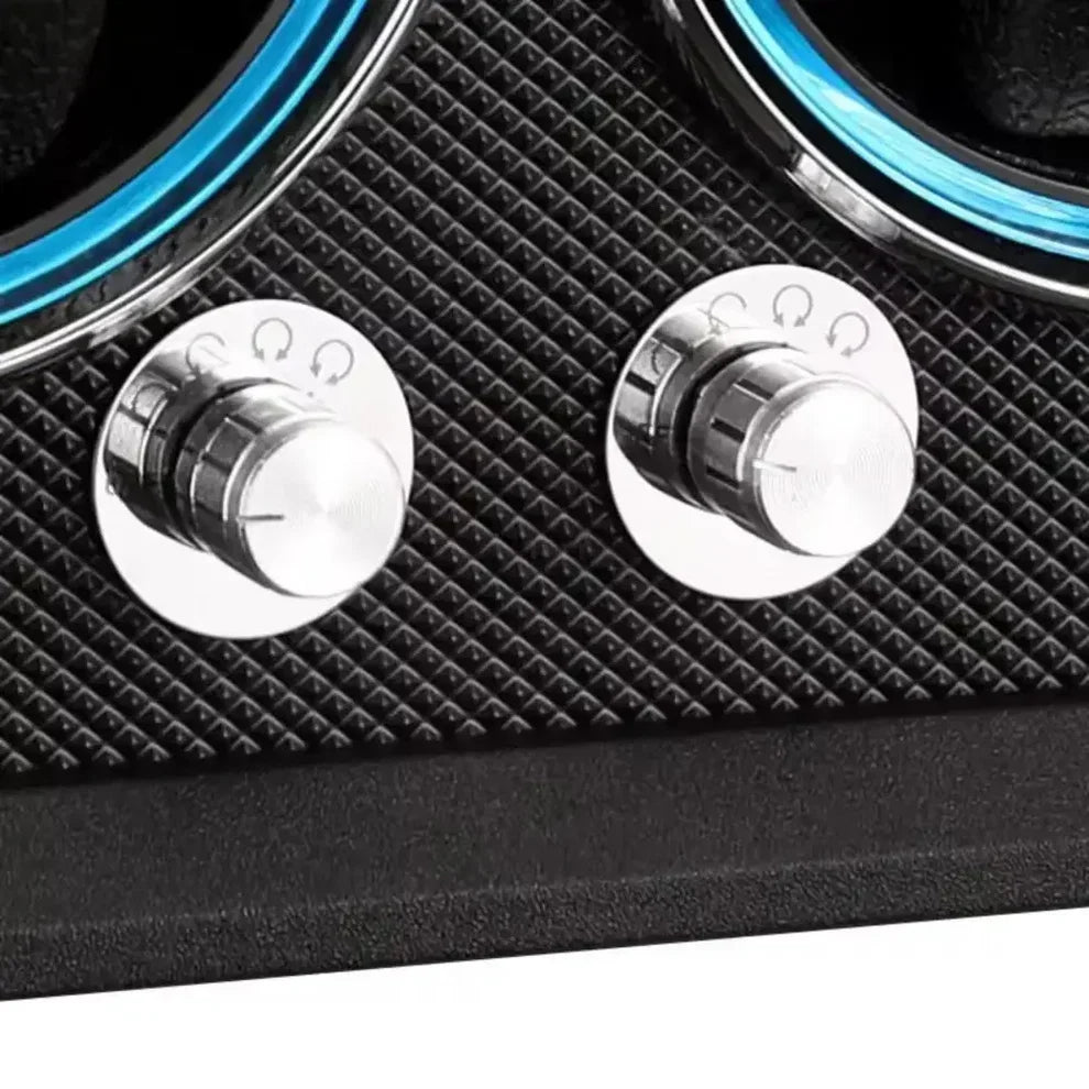 Black double watch winder with two rotary metal control knobs and textured finishes for automatic watches.