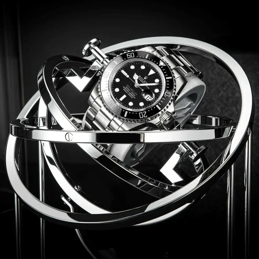 Black and silver metal Astronome Comète automatic watch winder, modern spherical design for a luxury watch.