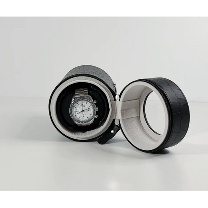 Black Rocket travel winder in crocodile faux leather with automatic watch on a grey suede interior cushion.