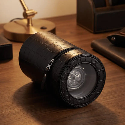 Cylindrical Rocket Black travel winder in black crocodile-effect faux leather with automatic watch visible.