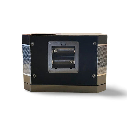 Rear view of the black carbon fibre watch winder with visible battery compartment and elegant design.