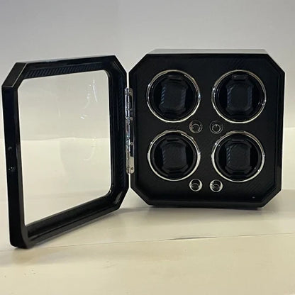 Black Gioco Carbone watch winder for 4 watches with carbon fibre finish, glazed door and built-in LED lighting.