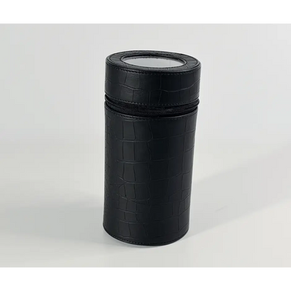 Cylindrical black Rocket travel winder in crocodile-effect faux leather with zip fastening and top window.