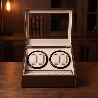 Brown leather watch winder with 4 automatic rotors and 6 storage slots, beige suede interior and glass lid.