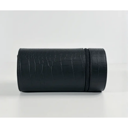 Black Rocket travel winder in crocodile-effect faux leather, compact cylindrical format for an automatic watch.