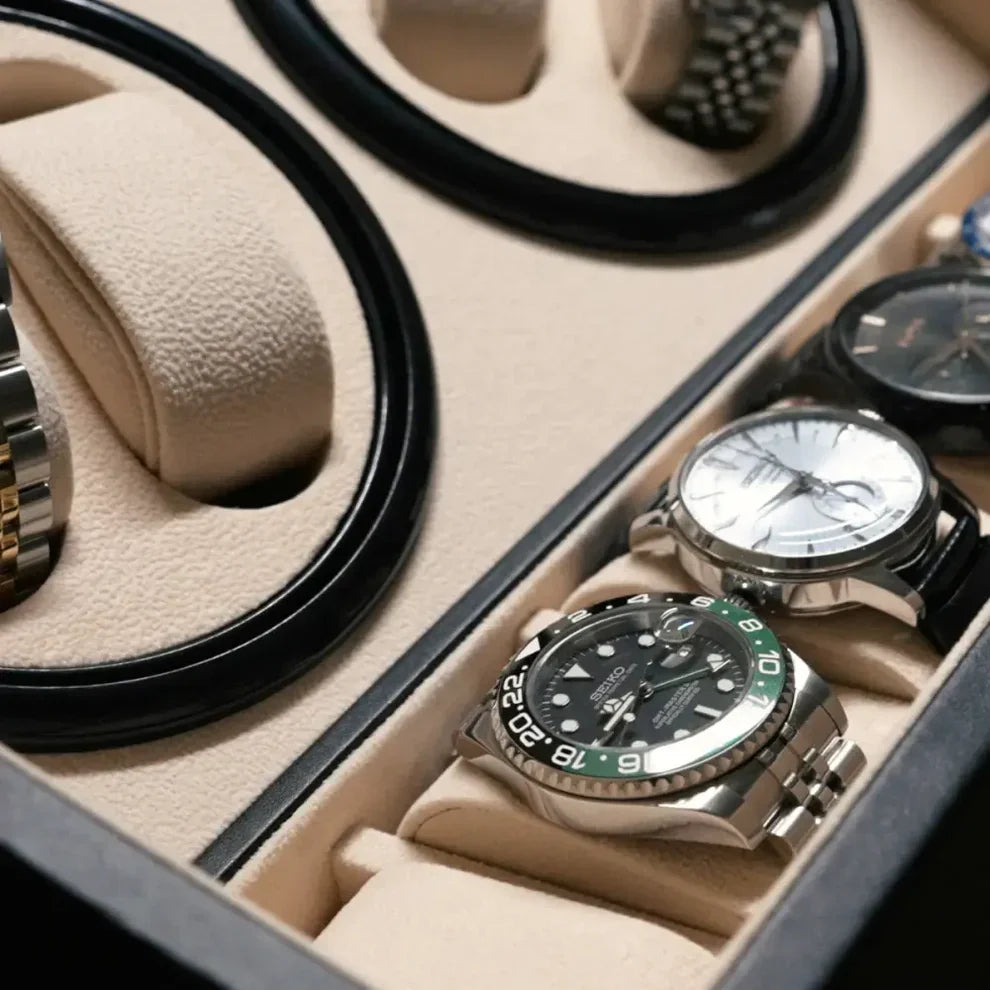 Black winder box for 10 watches with beige suede interior, motorised rotors and storage compartments.