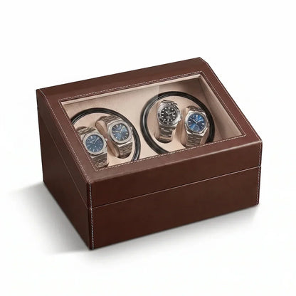 Brown leather watch winder with glass lid, 4 motorised slots for automatic watches and beige suede interior.