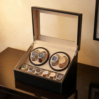Black leather winder box with glass lid, 4 motorised slots and 6 storage compartments for watches.